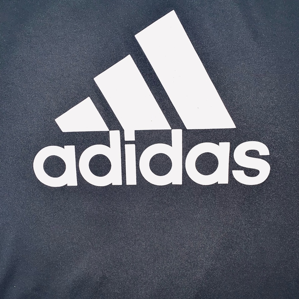The "Adidas Trefoil" t-shirt is a classic, featuring the iconic